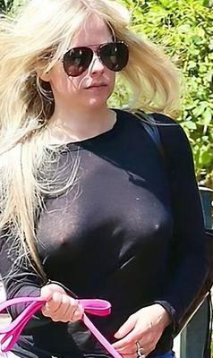 Avril Lavigne pokes through her top