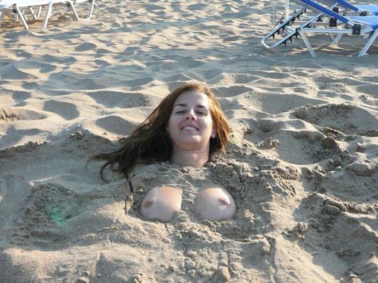 Amateur woman posing in the sand