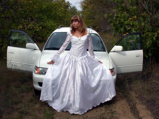 Cute outdoor teen bride in wedding dress