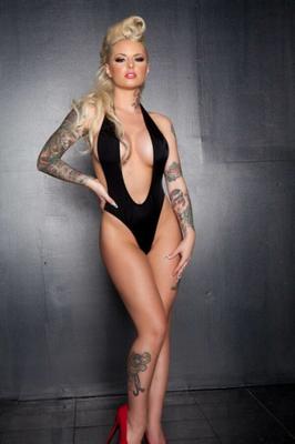 Christy Mack blonde bombshell in black