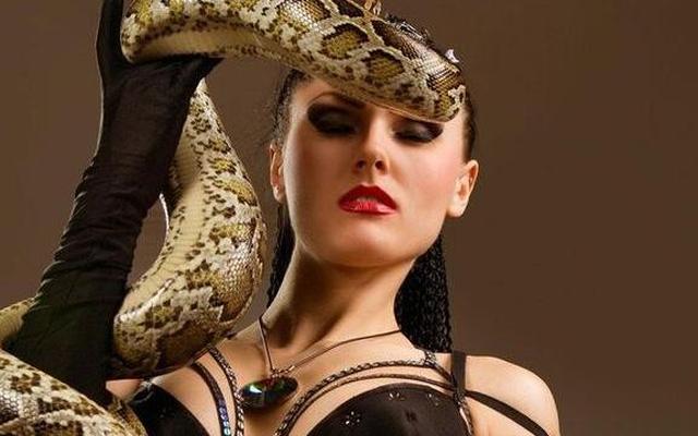 Ladies posing with snakes