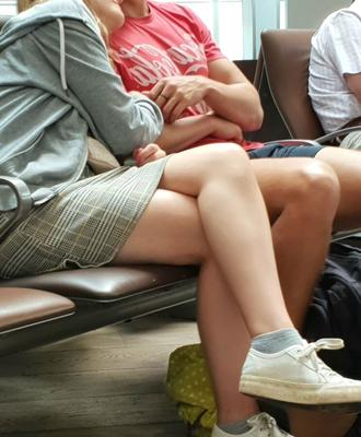 Crossed Legs posed on Planes and in Airports