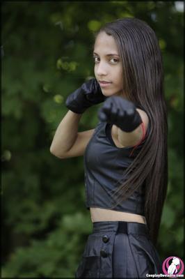 Beautiful teen strips off her leather costume